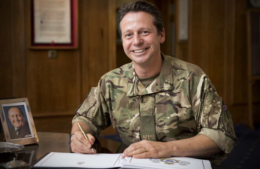 Nigel Huddleston MP signing the Visitors' Book at RAF Shawbury