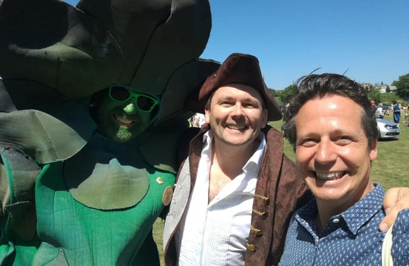 Nigel Huddleston MP with Gus the Asparagus Man at Evesham Carnival