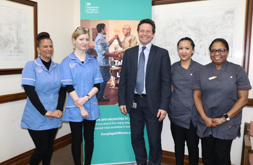 Nigel Huddleston MP with adult social care workers