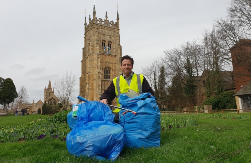 Nigel Huddleston MP with bags of litter