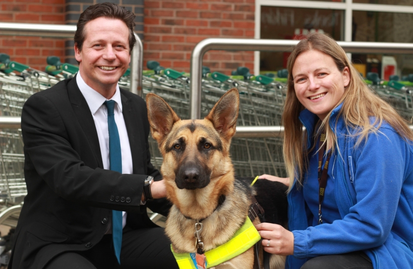 Nigel Huddleston MP with Guide Dog Nushka and trainer
