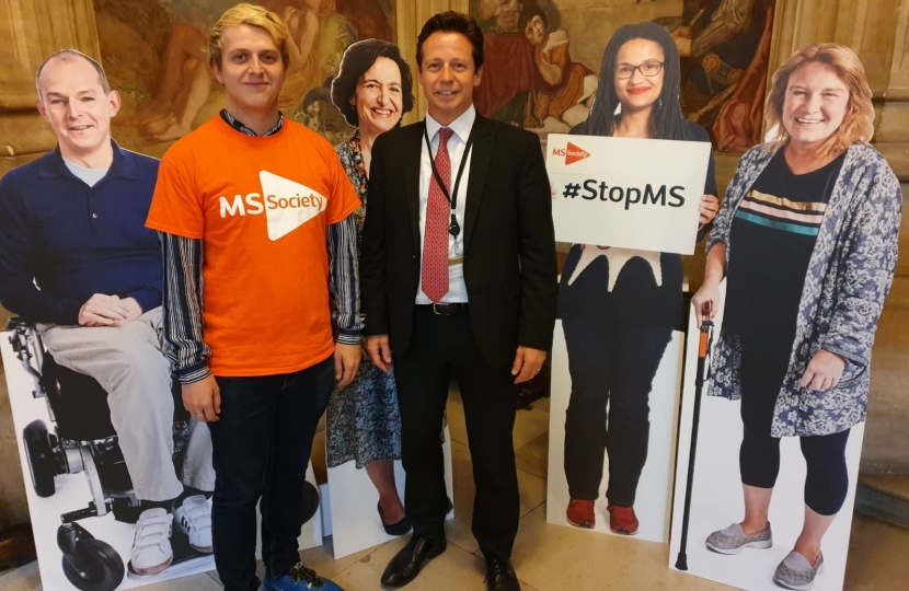 Nigel with cut outs of MS sufferers at the MS Parliament drop-in