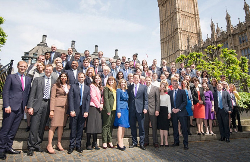 Nigel Huddleston and new MPs outside Parliament
