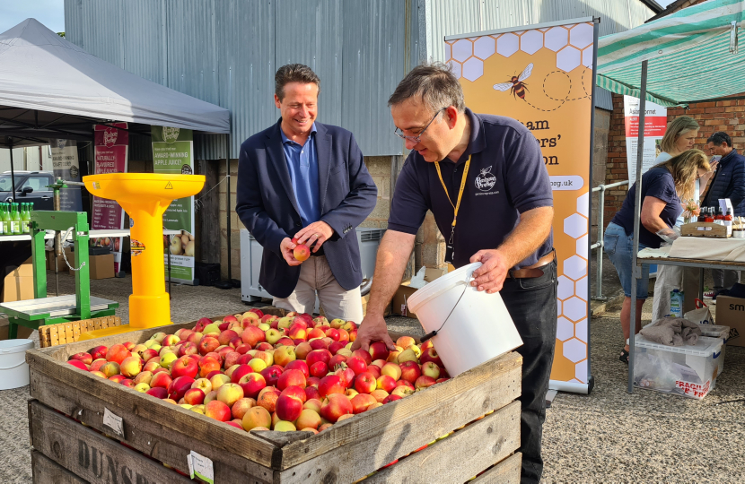 Nigel Huddleston MP presses first apple at Pershore College community day.