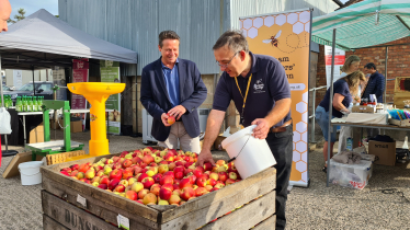 Nigel Huddleston MP presses first apple at Pershore College community day.